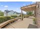 Back deck with overhead pergola and a landscaped backyard featuring mature plants at 1468 Fox Hollow Way, North Myrtle Beach, SC 29582