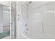 Bright bathroom with a shower-tub combo and a door opening to another room at 1468 Fox Hollow Way, North Myrtle Beach, SC 29582