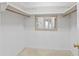 Walk-in closet with exposed beams and a mirror at the back at 1468 Fox Hollow Way, North Myrtle Beach, SC 29582