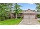 Beautiful brick home with a well-manicured lawn and a two-car garage, offering classic curb appeal at 1468 Fox Hollow Way, North Myrtle Beach, SC 29582