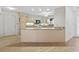 Eat-in kitchen with light wood cabinets, granite countertops, and modern appliances at 1468 Fox Hollow Way, North Myrtle Beach, SC 29582