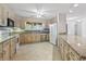 Bright eat-in kitchen featuring classic appliances and a window overlooking the backyard at 1468 Fox Hollow Way, North Myrtle Beach, SC 29582