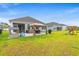 Expansive backyard with a gazebo, playground, and plenty of green space for outdoor entertainment and relaxation at 1523 Wood Stork Dr., Conway, SC 29526