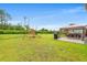 Spacious backyard featuring a playset, dining area under a gazebo, and a lush green lawn for outdoor activities at 1523 Wood Stork Dr., Conway, SC 29526