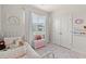 bedroom with a charming white bed, toy chest, and window view at 1523 Wood Stork Dr., Conway, SC 29526