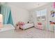 bedroom with a charming white bed, toy chest, and window view at 1523 Wood Stork Dr., Conway, SC 29526