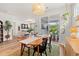 Open-concept dining area with a wooden table, stylish decor, and sliding doors to the outdoor space at 1523 Wood Stork Dr., Conway, SC 29526