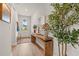 Inviting foyer with wood floors, console table with decor, and views of the front door at 1523 Wood Stork Dr., Conway, SC 29526
