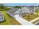 Beautiful aerial view of a well-maintained home with lush landscaping, manicured lawn, and inviting curb appeal at 1523 Wood Stork Dr., Conway, SC 29526