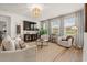 Bright living room featuring neutral furniture, stylish decor, and large windows with natural light at 1523 Wood Stork Dr., Conway, SC 29526