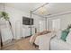 A main bedroom with neutral walls, a canopy bed and a view to an ensuite bathroom at 1523 Wood Stork Dr., Conway, SC 29526