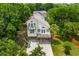 Stunning aerial view of a coastal home, surrounded by lush trees, showcasing its desirable neighborhood location at 154 Cedar Point Ave., Murrells Inlet, SC 29576