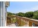 Exterior balcony features wooden railings and a view of the neighborhood street at 154 Cedar Point Ave., Murrells Inlet, SC 29576