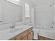 A bright bathroom featuring a mirror, sink, toilet and shower at 154 Cedar Point Ave., Murrells Inlet, SC 29576