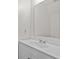 Close up of a bright bathroom featuring a sink and a large mirror at 154 Cedar Point Ave., Murrells Inlet, SC 29576