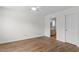 A cozy room featuring a walk-in bathroom and wood flooring at 154 Cedar Point Ave., Murrells Inlet, SC 29576