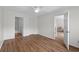 Bright bedroom featuring wood flooring and open doors at 154 Cedar Point Ave., Murrells Inlet, SC 29576