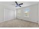 A bright bedroom offers natural light, carpet flooring, and a double door closet at 154 Cedar Point Ave., Murrells Inlet, SC 29576