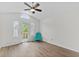 A vaulted ceiling bedroom with a glass paneled door with a sky light above at 154 Cedar Point Ave., Murrells Inlet, SC 29576