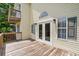 Large deck with wood flooring, offering a great outdoor space with double french doors at 154 Cedar Point Ave., Murrells Inlet, SC 29576