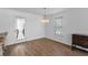 Bright dining room with wood floors and a charming chandelier at 154 Cedar Point Ave., Murrells Inlet, SC 29576