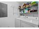 Laundry room area with a washer, dryer and wire shelving for storage at 154 Cedar Point Ave., Murrells Inlet, SC 29576