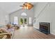 Spacious living room with fireplace and access to the outdoor deck at 154 Cedar Point Ave., Murrells Inlet, SC 29576
