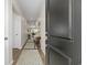 Inviting home foyer with hardwood floors, neutral walls, a decorative table, and doorway views to the living spaces at 154 Waterloo Sunset Dr., Longs, SC 29568