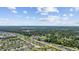 Beautiful aerial view of home in a community with lush greenery, water features, and well-maintained landscaping at 141 Lazy Willow Ln. # 103, Myrtle Beach, SC 29577