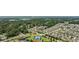 Scenic aerial view of the property showcases proximity to a pond, tennis courts, and well-kept surroundings at 141 Lazy Willow Ln. # 103, Myrtle Beach, SC 29577