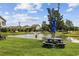 A picnic table with umbrella near a pond enhances outdoor enjoyment in the community at 141 Lazy Willow Ln. # 103, Myrtle Beach, SC 29577