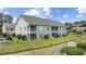 A multi-Gathering building with a waterway view from screened porches and ample greenery landscaping at 141 Lazy Willow Ln. # 103, Myrtle Beach, SC 29577