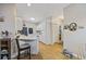 Charming kitchen with white cabinets, wood floors and a breakfast bar at 141 Lazy Willow Ln. # 103, Myrtle Beach, SC 29577