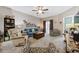 Bright living room with a ceiling fan and comfortable seating at 141 Lazy Willow Ln. # 103, Myrtle Beach, SC 29577