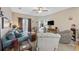 Inviting living room with soft seating, a ceiling fan, and access to the bedrooms at 141 Lazy Willow Ln. # 103, Myrtle Beach, SC 29577