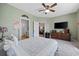 Spacious bedroom featuring a TV, ceiling fan and access to living room and bathroom at 141 Lazy Willow Ln. # 103, Myrtle Beach, SC 29577