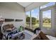An enclosed porch area with an exterior view offers a bright space to relax and enjoy the outdoors at 141 Lazy Willow Ln. # 103, Myrtle Beach, SC 29577