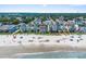 Aerial view of a beachfront home with access to a wide sandy beach, marked with a red pin at 1615 S Ocean Blvd. # 4, Surfside Beach, SC 29575