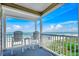 Inviting balcony offers picturesque views of the sandy beach, calm ocean, and blue sky at 1615 S Ocean Blvd. # 4, Surfside Beach, SC 29575
