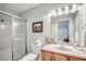 This bright bathroom features a shower stall, toilet, and sink at 1615 S Ocean Blvd. # 4, Surfside Beach, SC 29575
