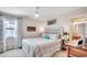This bedroom features a ceiling fan, ocean view, and coastal decor at 1615 S Ocean Blvd. # 4, Surfside Beach, SC 29575