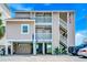 Multi-level home with dual balconies and a staircase, perfect for coastal living at 1615 S Ocean Blvd. # 4, Surfside Beach, SC 29575