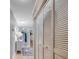 Neutral hallway with hardwood floors, flush mount lighting, storage closet, and white painted trim at 1615 S Ocean Blvd. # 4, Surfside Beach, SC 29575