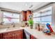 The kitchen features a counter with ocean views from two windows at 1615 S Ocean Blvd. # 4, Surfside Beach, SC 29575