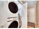 This space saving laundry room features a stackable washer and dryer at 1615 S Ocean Blvd. # 4, Surfside Beach, SC 29575