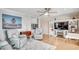 Light filled living room with hardwood floors, ceiling fan, comfortable seating, and modern decor at 1615 S Ocean Blvd. # 4, Surfside Beach, SC 29575