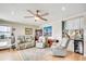 Open living room with hardwood floors, ceiling fan, modern decor and comfortable seating at 1615 S Ocean Blvd. # 4, Surfside Beach, SC 29575