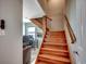 Wooden staircase leading up to a landing with a view of a bright office space at 1615 S Ocean Blvd. # 4, Surfside Beach, SC 29575