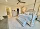 Spacious bedroom with four poster bed, sitting area and bathroom access at 17 Carson Creek Dr., Murrells Inlet, SC 29576