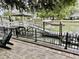 Private dock with a boat lift and a patio area for outdoor enjoyment at 17 Carson Creek Dr., Murrells Inlet, SC 29576